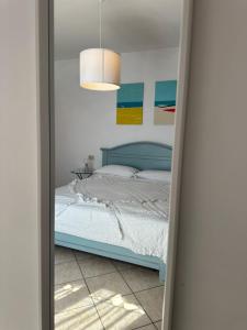 Postel nebo postele na pokoji v ubytování B&B SGUARDO AL CONERO