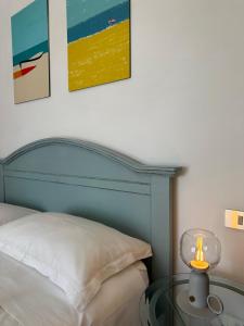 Postel nebo postele na pokoji v ubytování B&B SGUARDO AL CONERO