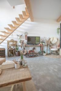 a living room filled with furniture and a flat screen tv at Modern Villa Close to Beach in Tarnos