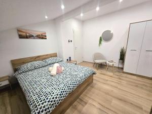 Кровать или кровати в номере Apartmani Krnić