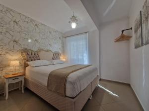 Postel nebo postele na pokoji v ubytování Iro Apartments