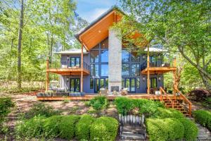 a home in the woods with a large house at Eagle's View in Dadeville
