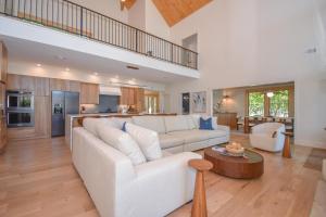 a living room with a white couch and a table at Eagle's View in Dadeville