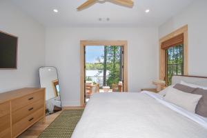 a bedroom with a bed and a dresser and a mirror at Eagle's View in Dadeville