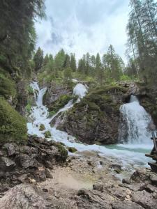 a view of a river with two falls at Gardenia in Dimaro