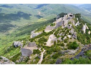 an aerial view of a castle on a mountain at Roulotte pour amoureux de la nature in Bugarach