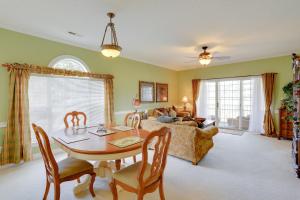 a living room with a table and a couch at 2 Mi to Broadway at the Beach Myrtle Beach Condo in Myrtle Beach