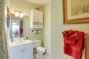 a bathroom with a white sink and a toilet at 2 Mi to Broadway at the Beach Myrtle Beach Condo in Myrtle Beach +17 photos