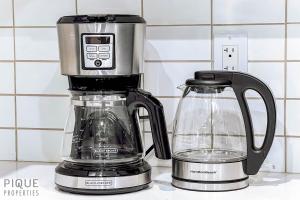 a coffee maker and a blender on a counter at NEW-The Suite Life-2BD-King Bed-WEM & YEG Airport in Edmonton