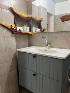 a bathroom with a sink and a mirror at Unique Suite In Eilat in Eilat +28 photos