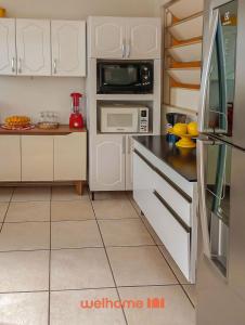 Кухня или кухненски бокс в Cobertura com Vista e Conforto no RS