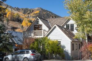 a house with a car parked in front of it at 211 A South Oak by Exceptional Stays in Telluride