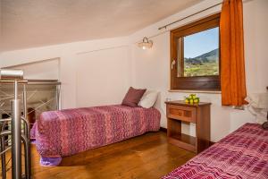 A bed or beds in a room at APT Villa Anna e APT Cantina Vito vicinissimi alla Riserva dello Zingaro