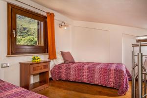 A bed or beds in a room at APT Villa Anna e APT Cantina Vito vicinissimi alla Riserva dello Zingaro
