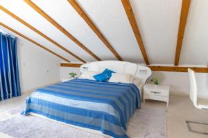 Postel nebo postele na pokoji v ubytování Guest House Aldin