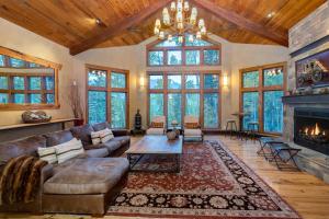 a living room with a couch and a fireplace at Alpenglow by Exceptional Stays in Telluride
