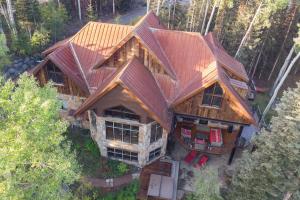 an overhead view of a large wooden house in the woods at Alpenglow by Exceptional Stays in Telluride