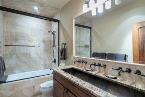 a bathroom with a large shower and a sink at Alpenglow by Exceptional Stays in Telluride