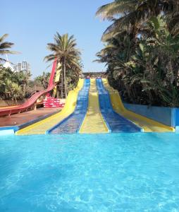 a long water slide at a water park at Ocean & Canal Views - The Sails Apartment in Durban