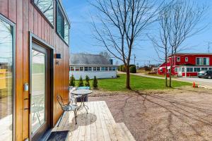 a patio with a table next to a building at Cottage Retreat in Colchester
