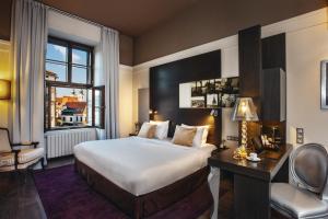 Voodi või voodid majutusasutuse Grand Palace Brno toas