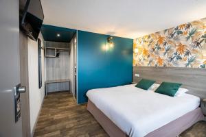 Postel nebo postele na pokoji v ubytování Kyriad Valenciennes Sud - Rouvignies