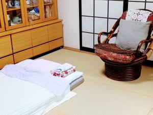 Postel nebo postele na pokoji v ubytování 民泊 B&B yoshida
