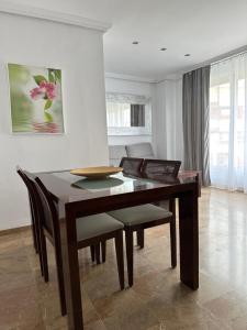 a dining room with a table and chairs at 5 Caballeros in Puente Genil