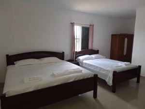 Katil atau katil-katil dalam bilik di Day And Night Hotel Belmopan +31 gambar