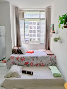 Ένα ή περισσότερα κρεβάτια σε δωμάτιο στο Studio no Flamengo - RJ