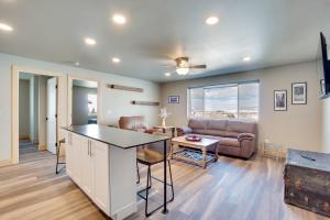 a living room with a couch and a table at Saratoga Retreat about 3 Mi to Saratoga Lake! in Saratoga