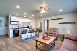 a kitchen and living room with a couch and a table at Saratoga Retreat about 3 Mi to Saratoga Lake! in Saratoga