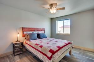 a bedroom with a bed and a ceiling fan at Saratoga Retreat about 3 Mi to Saratoga Lake! in Saratoga