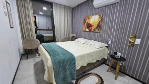 a small room with a bed and a room with a bedroom at Luxury Paiva Flat in Recife