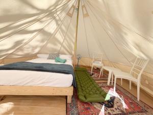 Postel nebo postele na pokoji v ubytování BACALAR INN Hotel
