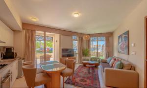 a living room with a couch and a table at Luxury Stays in Mangroovy El Gouna in Hurghada