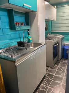 Nhà bếp/bếp nhỏ tại Departamento a pasos del Mall Espacio Urbano Punta Arenas