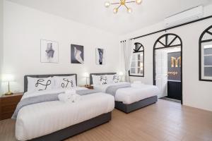 En eller flere senge i et værelse på Beachside Patong 50m or less min walk