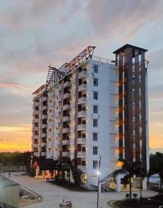 a large building with a crane on top of it at Tropical Hideaway with Pool 1BR Panglao in Dauis