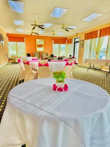 a room with a table with a pink ribbon on it at Travelodge by Wyndham-Thomasville AL in Thomasville