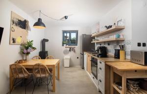 a kitchen with a table and chairs and a table and a counter at Villa Stanza in Rovinj
