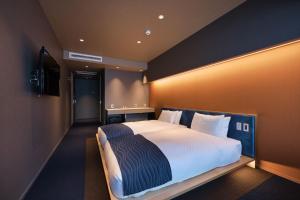 Postel nebo postele na pokoji v ubytování Minn Nijo-jo