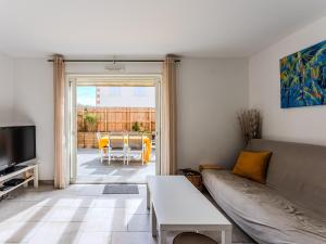 a living room with a couch and a table at Maison spacieuse à Biscarrosse-Plage près de l'océan - FR-1-521-251 in Biscarrosse