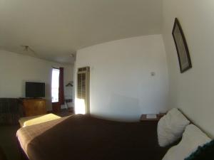 Postel nebo postele na pokoji v ubytování Rycroft Hotel