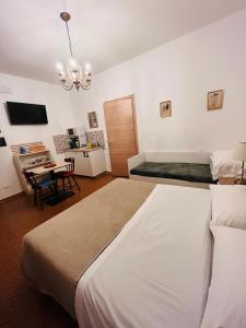Postel nebo postele na pokoji v ubytování Pisa House