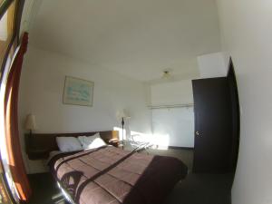 Postel nebo postele na pokoji v ubytování Rycroft Hotel