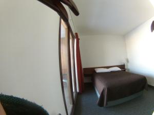 Postel nebo postele na pokoji v ubytování Rycroft Hotel