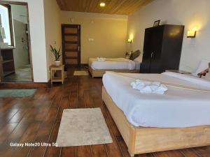 Postel nebo postele na pokoji v ubytování Miknaon Farmstay