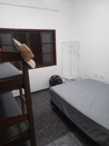 Ένα ή περισσότερα κρεβάτια σε δωμάτιο στο Casa 2 - Sossego