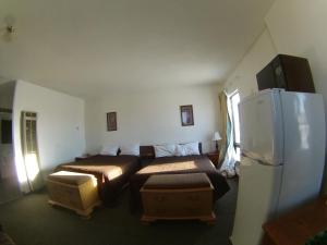 Postel nebo postele na pokoji v ubytování Rycroft Hotel
